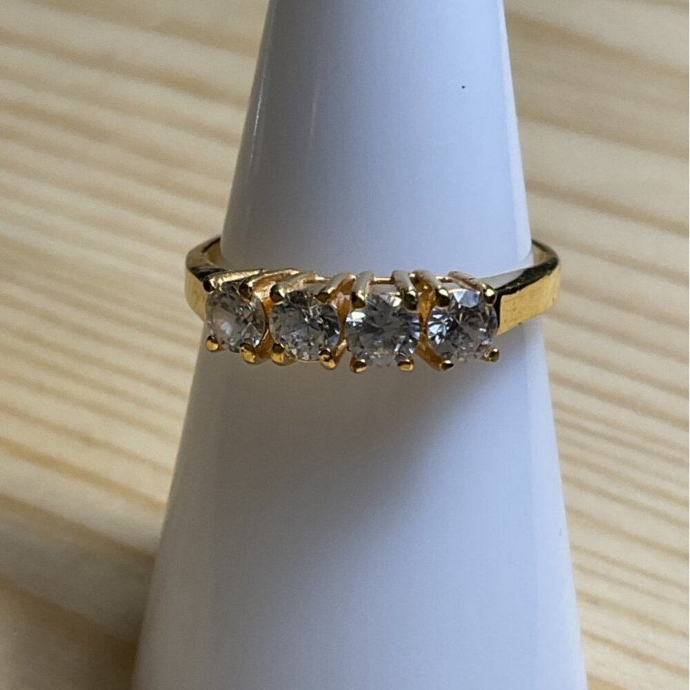Gold-Tone Ring With 4 Clear Round Stones